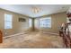 Bright bedroom with neutral walls, carpet flooring, and natural light from multiple windows at 22662 E Narrowleaf Cir, Aurora, CO 80016
