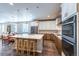 Spacious kitchen with modern appliances, an island with stools and hardwood floors at 22662 E Narrowleaf Cir, Aurora, CO 80016