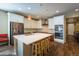 Spacious kitchen with modern appliances, an island with stools and hardwood floors at 22662 E Narrowleaf Cir, Aurora, CO 80016