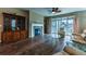 Open floor plan with a fireplace and hardwood floors that connect kitchen and living spaces at 22662 E Narrowleaf Cir, Aurora, CO 80016