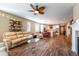 Open floor plan with a fireplace and hardwood floors that connect kitchen and living spaces at 22662 E Narrowleaf Cir, Aurora, CO 80016