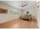 Bright bedroom featuring a ceiling fan, and natural light through the window at 8205 Pennsylvania St, Denver, CO 80229