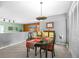 Cozy dining room with modern lighting, adjacent to a spacious living area perfect for entertaining at 8205 Pennsylvania St, Denver, CO 80229