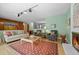 Spacious living room with fireplace and hardwood floors perfect for entertaining guests or relaxing at 8205 Pennsylvania St, Denver, CO 80229