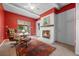 Cozy living room with fireplace, brick surround, and access to the outdoors at 8205 Pennsylvania St, Denver, CO 80229