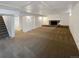 Finished basement space offering ample room, a fireplace, and stairway access for convenience at 13477 E Center Ave, Aurora, CO 80012