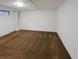 Unfinished basement space with essential outlets and a small window for natural light at 13477 E Center Ave, Aurora, CO 80012
