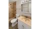 Cozy bathroom with bathtub, shower combo, and a vanity sink at 13477 E Center Ave, Aurora, CO 80012