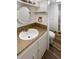 Bathroom vanity and a toilet with a shower stall in the background, plus wooden floors at 13477 E Center Ave, Aurora, CO 80012