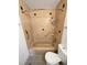 Tiled bathroom featuring a shower-tub combo with safety bars and coordinated fixtures at 13477 E Center Ave, Aurora, CO 80012
