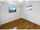Bright bedroom with hardwood floors and dual windows at 13477 E Center Ave, Aurora, CO 80012