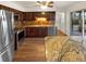 Modern kitchen with stainless steel appliances, granite countertops, and wood cabinets at 13477 E Center Ave, Aurora, CO 80012