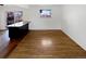 Bright living room with hardwood floors and granite countertop bar at 13477 E Center Ave, Aurora, CO 80012