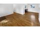 Open-concept room featuring hardwood floors, and neutral walls at 13477 E Center Ave, Aurora, CO 80012