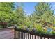 Balcony view with flowers, trees, and blue sky at 701 Harlan St # E29, Lakewood, CO 80214