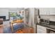 Open kitchen with stainless steel refrigerator and view to living room at 701 Harlan St # E29, Lakewood, CO 80214