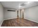 Finished basement with hardwood floors and neutral colored walls at 7476 E Arkansas Ave # 1-03, Denver, CO 80231
