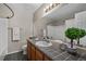 Bathroom with a tiled countertop and floors, and shower-tub combo at 7476 E Arkansas Ave # 1-03, Denver, CO 80231