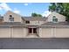 Charming townhome featuring individual garages and inviting entryway at 7476 E Arkansas Ave # 1-03, Denver, CO 80231