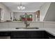 Kitchen sink overlooking the living room and back patio at 7476 E Arkansas Ave # 1-03, Denver, CO 80231