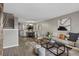 Open concept living room and dining area with hardwood floors at 7476 E Arkansas Ave # 1-03, Denver, CO 80231