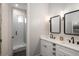 Modern bathroom featuring double sinks, a walk-in shower, and contemporary design at 11229 Running Kit Pl, Franktown, CO 80116