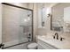 Well-lit bathroom with a shower over tub, sleek vanity, and modern fixtures at 11229 Running Kit Pl, Franktown, CO 80116