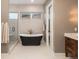 Stunning bathroom with a standalone tub, walk-in shower, and modern fixtures at 11229 Running Kit Pl, Franktown, CO 80116