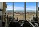 Bright living room boasting mountain views with floor to ceiling sliding doors and modern decor at 11229 Running Kit Pl, Franktown, CO 80116