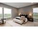 Bright main bedroom features a neutral color palette, large windows, and minimalist décor at 11229 Running Kit Pl, Franktown, CO 80116