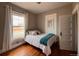 Bedroom featuring hardwood floors, natural light, and a closet at 3890 N Wolff St, Denver, CO 80212