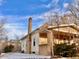 Charming home exterior featuring brick accents and covered porch at 3890 N Wolff St, Denver, CO 80212