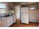 Traditional kitchen featuring white cabinets and modern appliances at 3890 N Wolff St, Denver, CO 80212