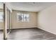 Bright bedroom with mirrored closet doors and grey wood-look flooring at 1312 S Cathay Ct # 202, Aurora, CO 80017