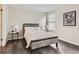 Cozy bedroom with a wood-look bed frame and grey wood-look flooring at 1312 S Cathay Ct # 202, Aurora, CO 80017