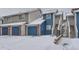 Exterior view of the townhome with snow at 1312 S Cathay Ct # 202, Aurora, CO 80017