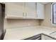 White kitchen cabinets and expansive countertops at 1312 S Cathay Ct # 202, Aurora, CO 80017