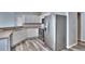Bright kitchen with stainless steel appliances, white cabinets, and vinyl flooring at 17205 Waterhouse Cir # C, Parker, CO 80134