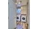 Well-lit laundry room includes washer, dryer, and overhead cabinets at 17205 Waterhouse Cir # C, Parker, CO 80134