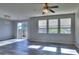 Inviting living room features lots of natural light, ceiling fan, and sleek flooring at 17205 Waterhouse Cir # C, Parker, CO 80134