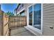 Private outdoor patio with wood fence and sliding glass door, perfect for enjoying outdoor living at 17205 Waterhouse Cir # C, Parker, CO 80134