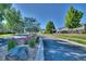 Picturesque street view with vibrant landscaping, sidewalks and manicured lawns, offering a welcoming community atmosphere at 17205 Waterhouse Cir # C, Parker, CO 80134