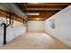 Unfinished basement with exposed wood beams, insulation, and potential for customization at 13906 Jackson St, Thornton, CO 80602