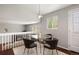 Cozy dining area with modern table set, with clear view to living room at 13906 Jackson St, Thornton, CO 80602