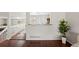 Cozy living space with hardwood floors and convenient kitchen access at 13906 Jackson St, Thornton, CO 80602