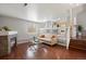 Comfortable living room, featuring modern fireplace and view to kitchen and second story at 13906 Jackson St, Thornton, CO 80602