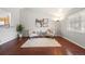 Bright living room with hardwood floors, a large window, and tasteful decor at 13906 Jackson St, Thornton, CO 80602
