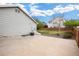 Spacious backyard with a large concrete patio, perfect for entertaining, and a well-maintained lawn area at 13906 Jackson St, Thornton, CO 80602