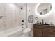 Modern bathroom with marble tile, sleek vanity, and stylish fixtures at 1326 Sable Blvd, Aurora, CO 80011
