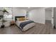Spacious bedroom with hardwood floors, natural light, and comfortable bedding at 1326 Sable Blvd, Aurora, CO 80011